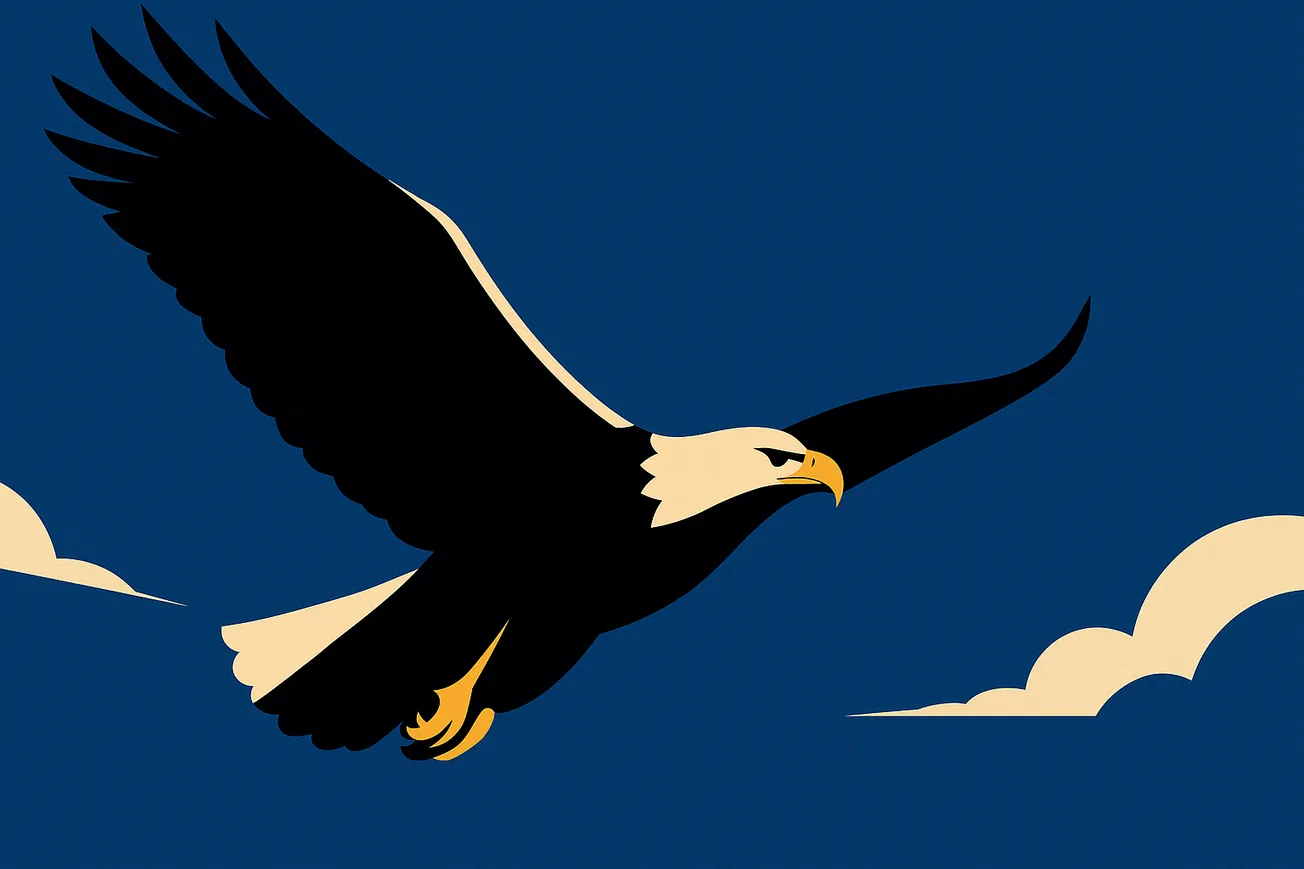 Eagle soaring through a clear blue sky.
